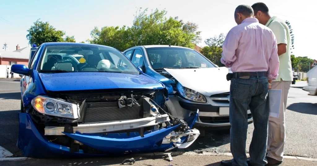 Two men having a car crash dispute.