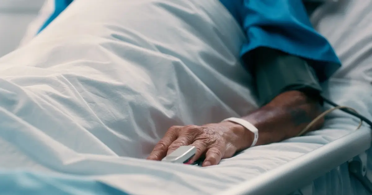 elderly person in hospital bed