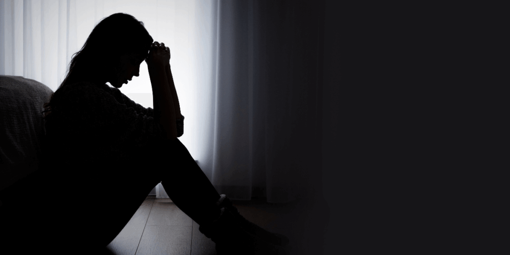 profile of an upset woman in silhouette