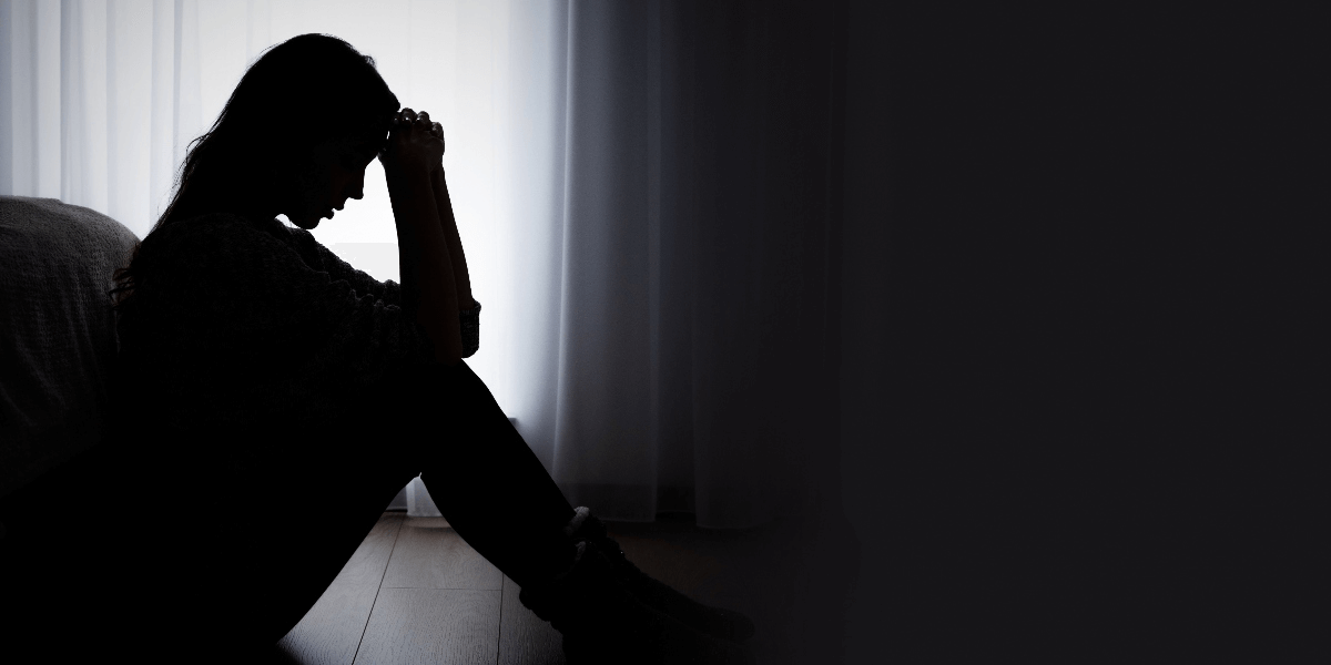 profile of an upset woman in silhouette