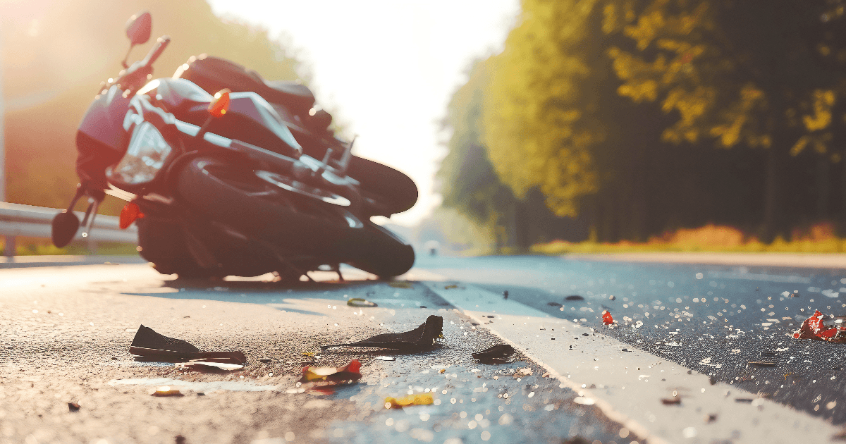 crashed motorcycle lying on rural road in Long Island